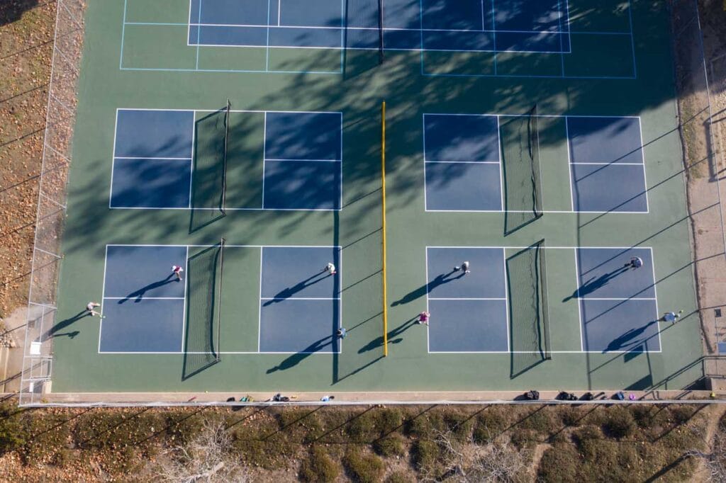 Aerial view of Brommer Street County Park pickleball courts, showcasing multiple courts and players in action.