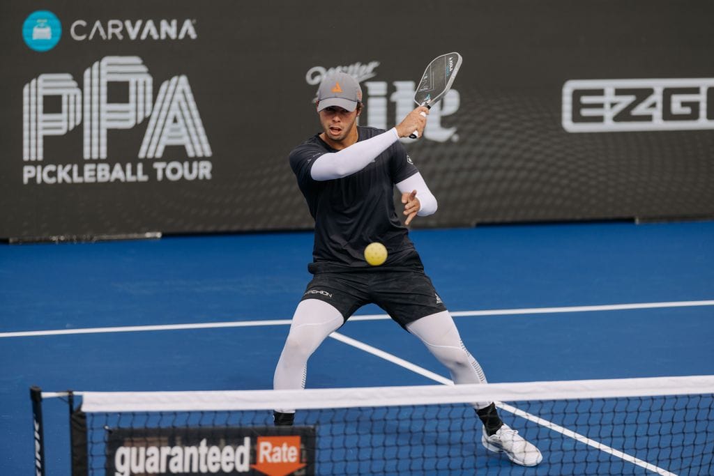 A professional pickleball player demonstrating how to hold a pickleball paddle correctly during a match at the PPA Pickleball Tour.