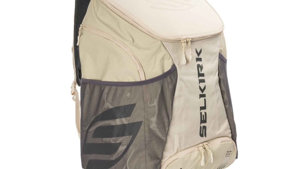 Selkirk Tour Backpack - Large Pickleball Bag in beige and gray with multiple compartments for paddles, balls, and gear.